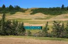 A green ATCO trailer sitting in the middle of the Cypress Hills