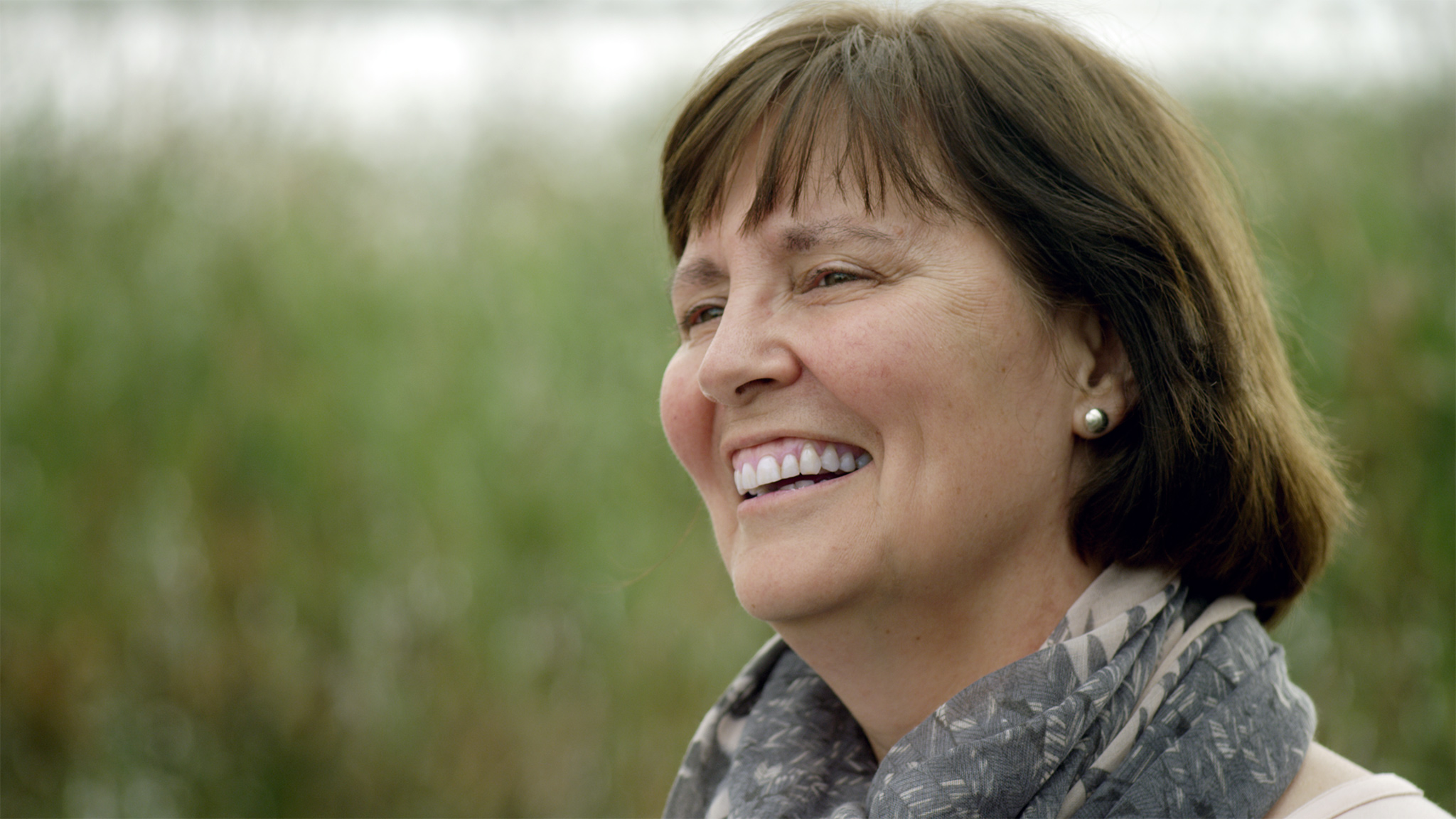Maureen Reed smiles while at Redberry Lake. Dr. Maureen Reed is a professor in the School of Environment and Sustainability at the University of Saskatchewan. She co-led the Social Dimensions of Climate Hazards project with Fletcher. (Photo by Zachary Melnick)