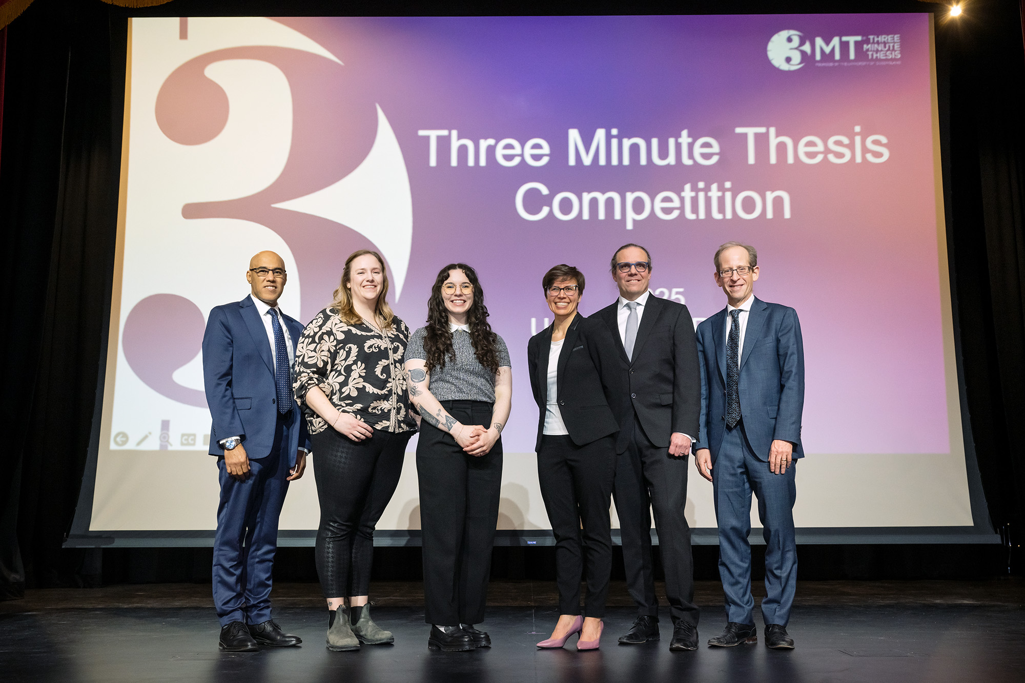03-24-03 L to R: Dr. Aziz Douai, Dean of the Faculty of Graduate Studies and Research, 1st place winner Baily Hack, 2nd place winner Angèle Poirier, 3rd Place & People’s Choice Winner Elise Melanson, Dr. Chris Yost, Vice-President (Research), and Dr. Jeff Keshen, President and Vice-Chancellor. (Photo by Trevor Hopkin)