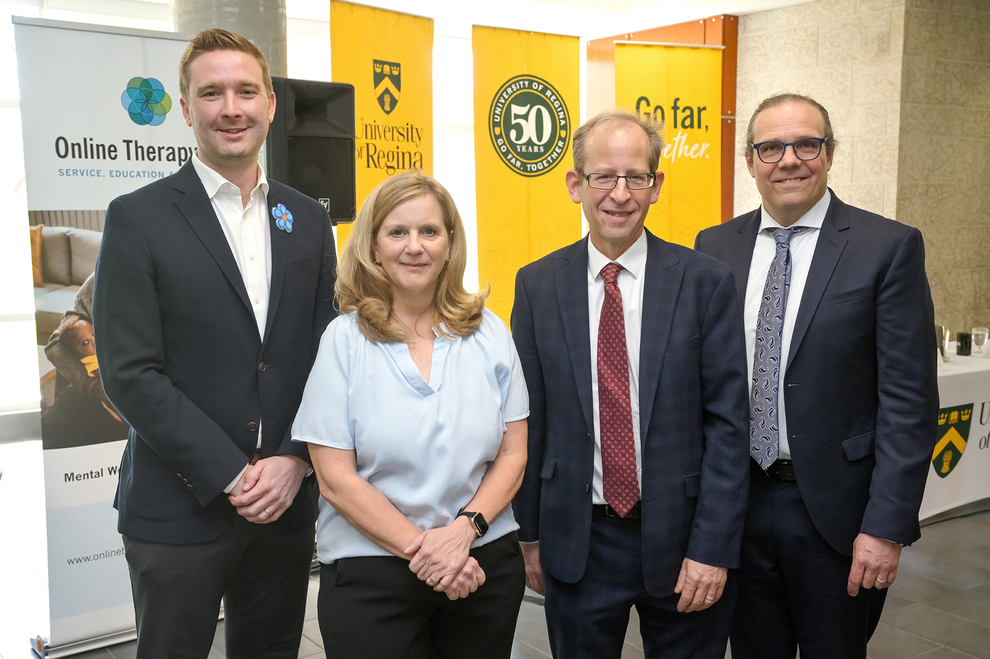 _URE5334 web (l to r) The Honourable Jeremy Cockrill (Minister of Health), Dr. Heather Hadjistavropoulos (psychology professor and director of the Online Therapy Unit), Dr. Jeff Keshen (U of R president and vice-chancellor), and Dr. Chris Yost (U of R Vice-President of Research) (Photo by Trevor Hopkin)