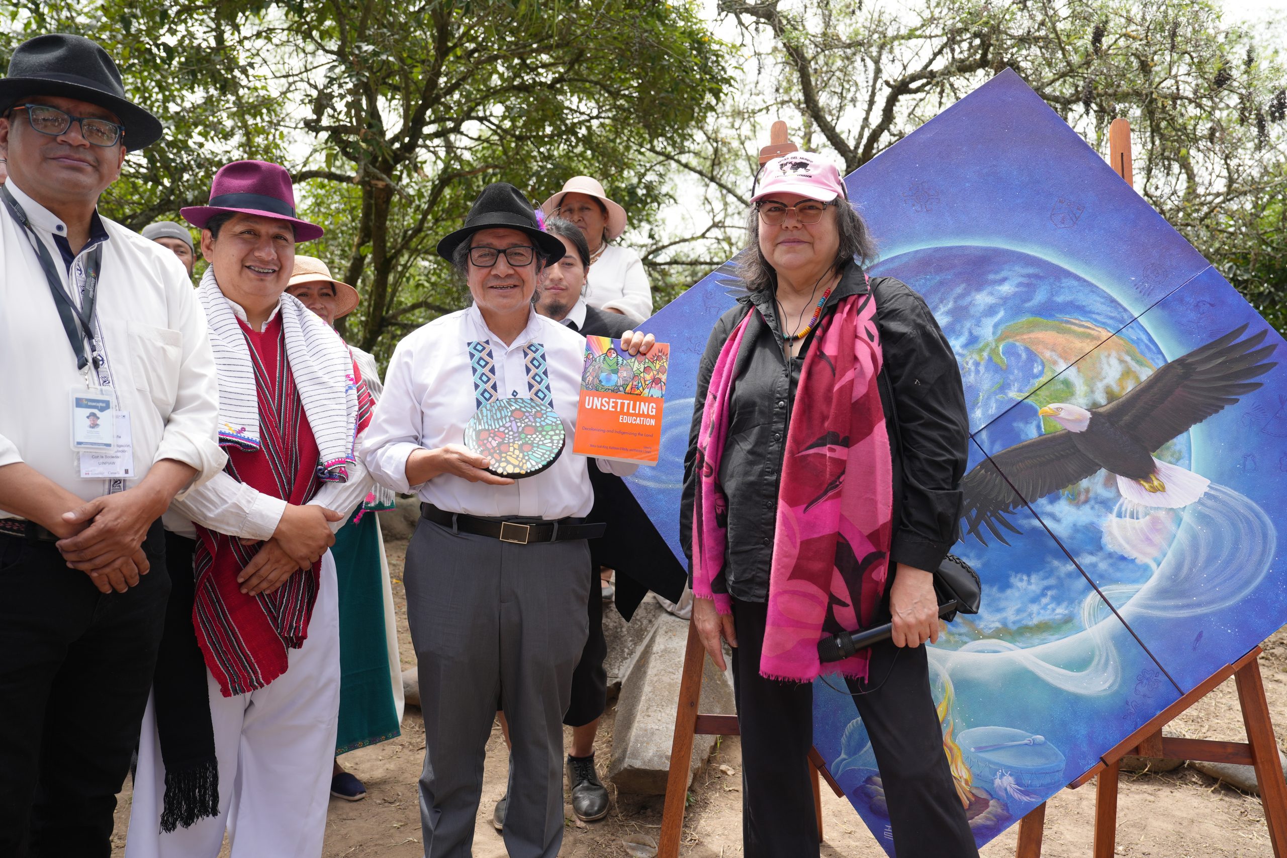 Dr. Anna-Leah King presenting gifts to Dr. Armando Muyolma, President of Amawtay Wasi University, and Dr. Freddy Simbaña, Vice-Rector of Research, Innovation, and Community Engagement at Amawtay Wasi.  (Photo courtesy of Amawtay Wasi University)